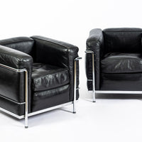 Pair of Cassina LC2 Black Leather Petit Lounge Chairs by Le Corbusier