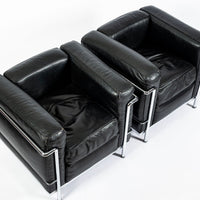 Pair of Cassina LC2 Black Leather Petit Lounge Chairs by Le Corbusier
