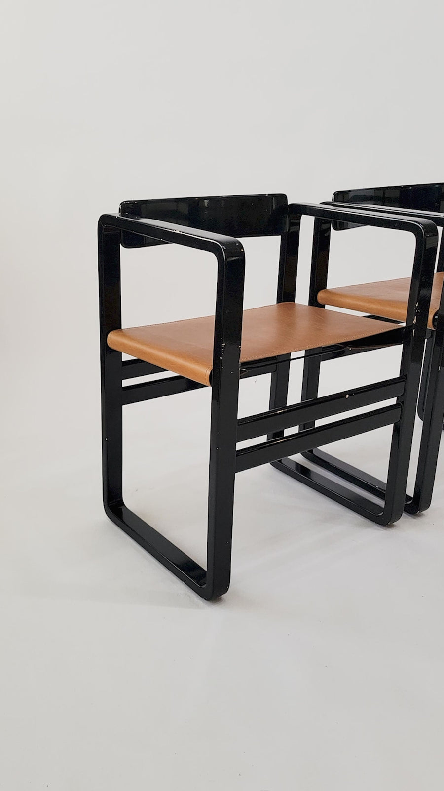 Mid Century Modern Black Lacquer and Brown Leather Arm Chairs 1970s